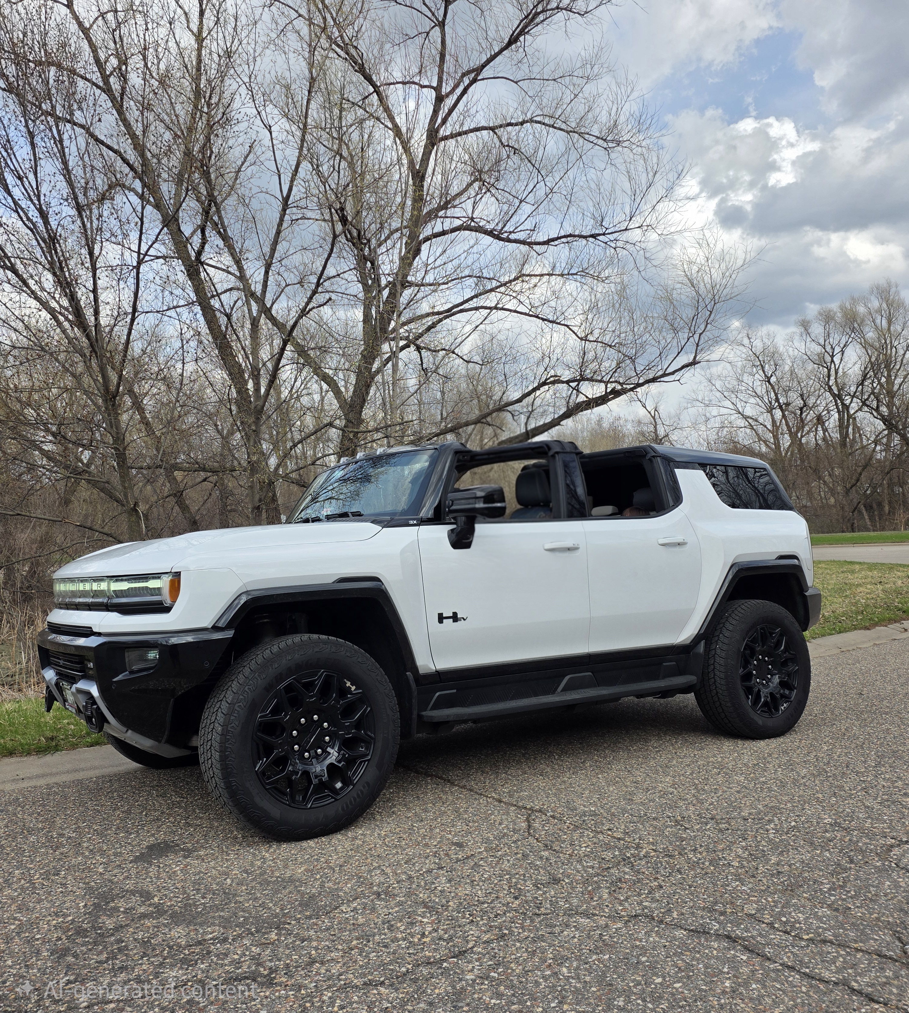 White HUMMER EV with its removable roof panels open